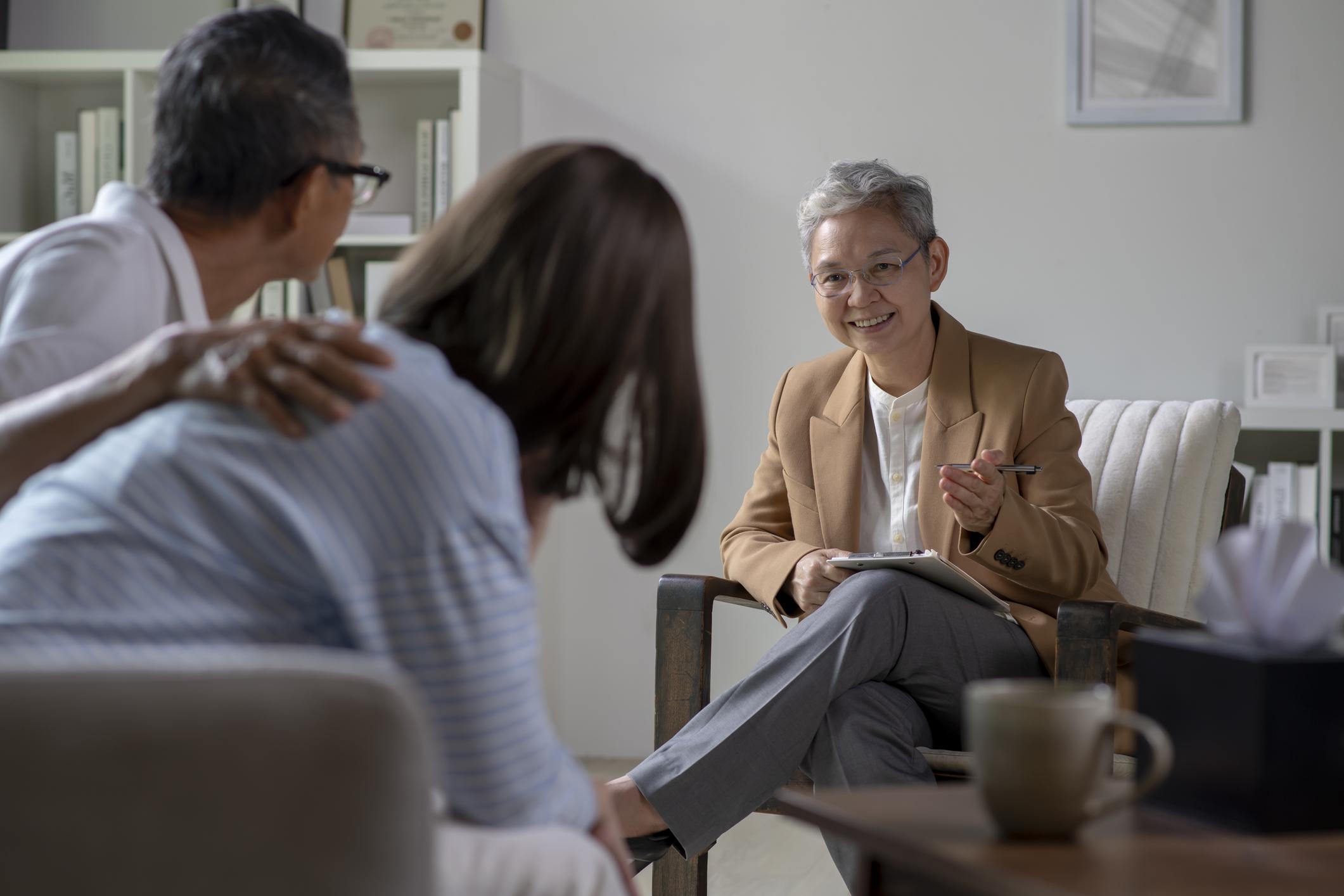 therapist talking to a couple